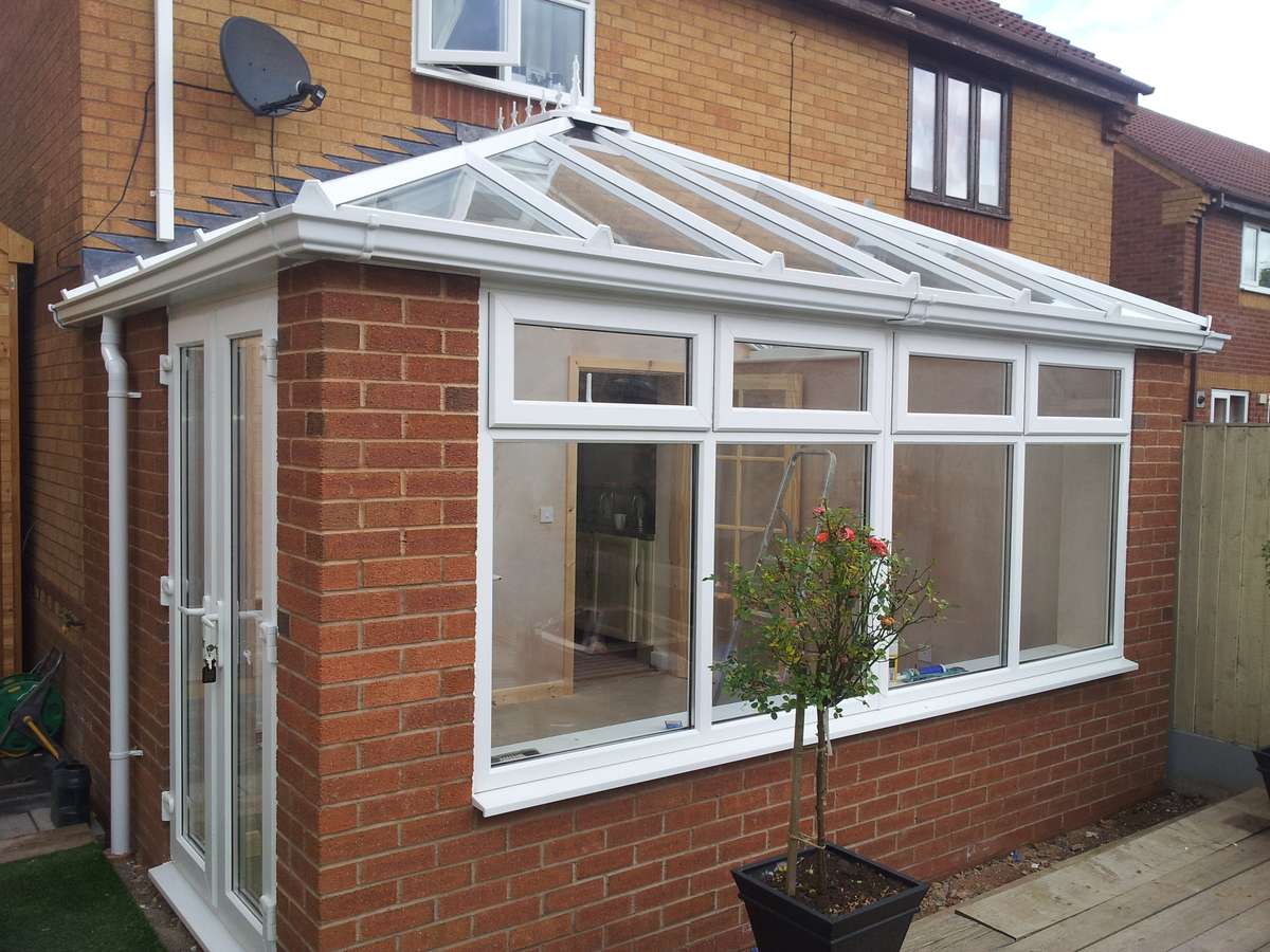 Brick conservatory with a glass roof