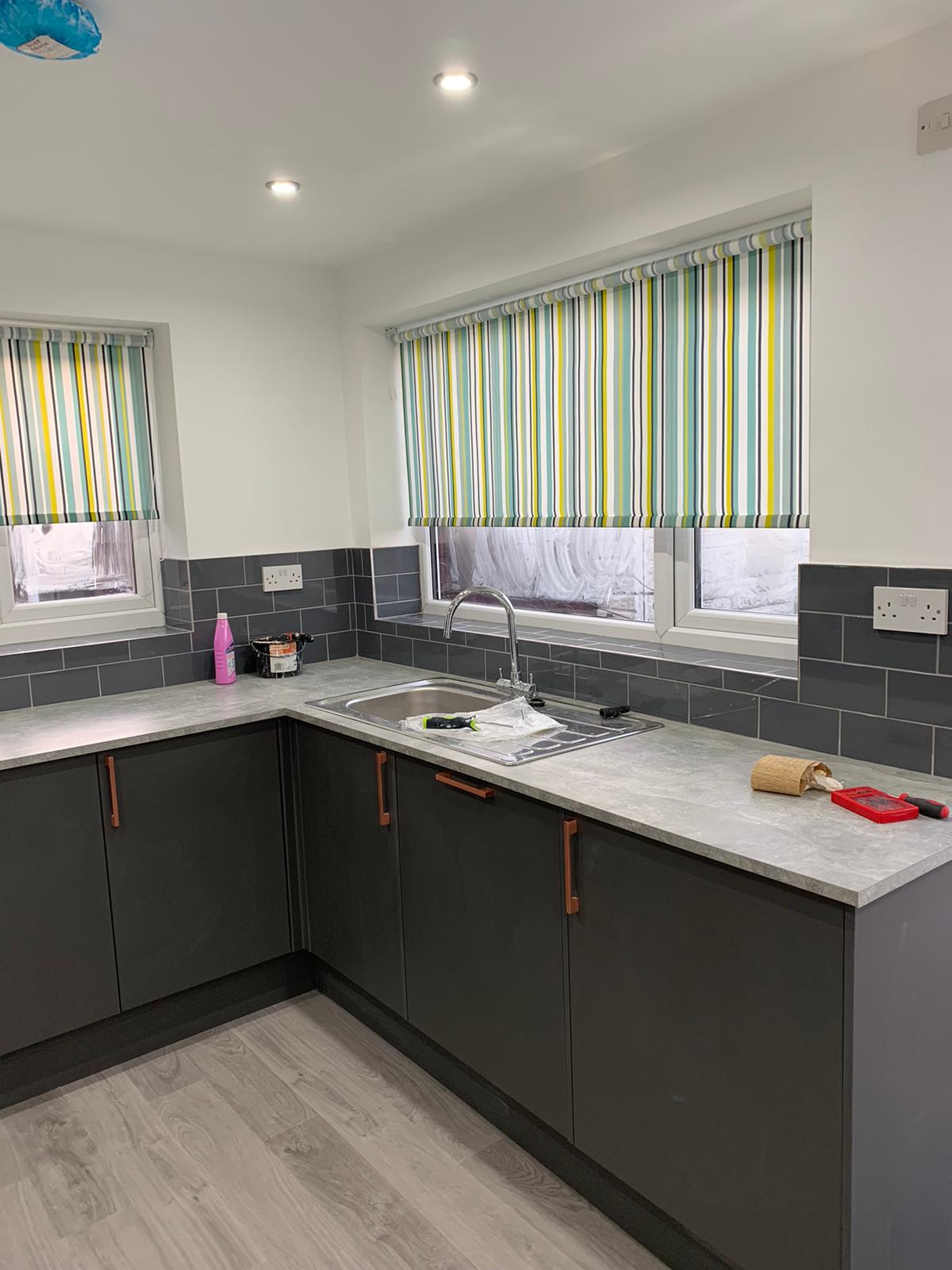High gloss, grey kitchen and wall tiles