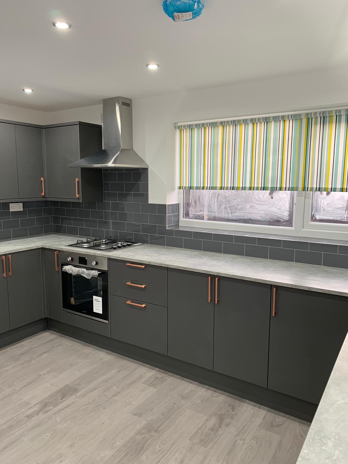 High gloss, grey kitchen and wall tiles